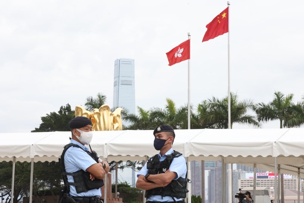 Police stand outside the Hong Kong Convention and Exhibition Centre in Wan Chai during the chief executive election on May 8. Photo: K. Y. Cheng
