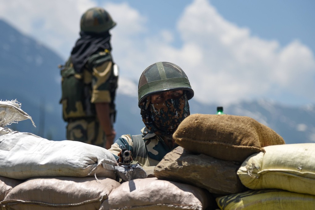 A soldier of the Indian Border Security Force (BSF) guards a national highway leading to Ladakh region. Photo: dpa