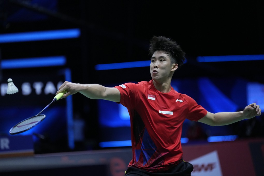 Singapore’s Loh Kean Yew returns a shot to South Korea’s Heo Kwanghee during their men’s singles qualifying match at Thomas & Uber Cup in Bangkok. Photo: AP