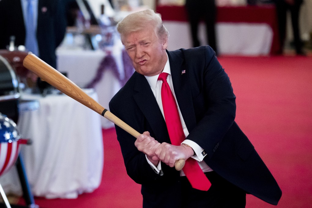 Then US president Donald Trump swings a baseball bat made by the Texas Timber Bat Company, while participating in the Spirit of America Showcase, at the White House on July 2, 2020. During his term, Trump, who pledged to bring manufacturing jobs back to the US, instituted a trade war with China. Photo: EPA-EFE