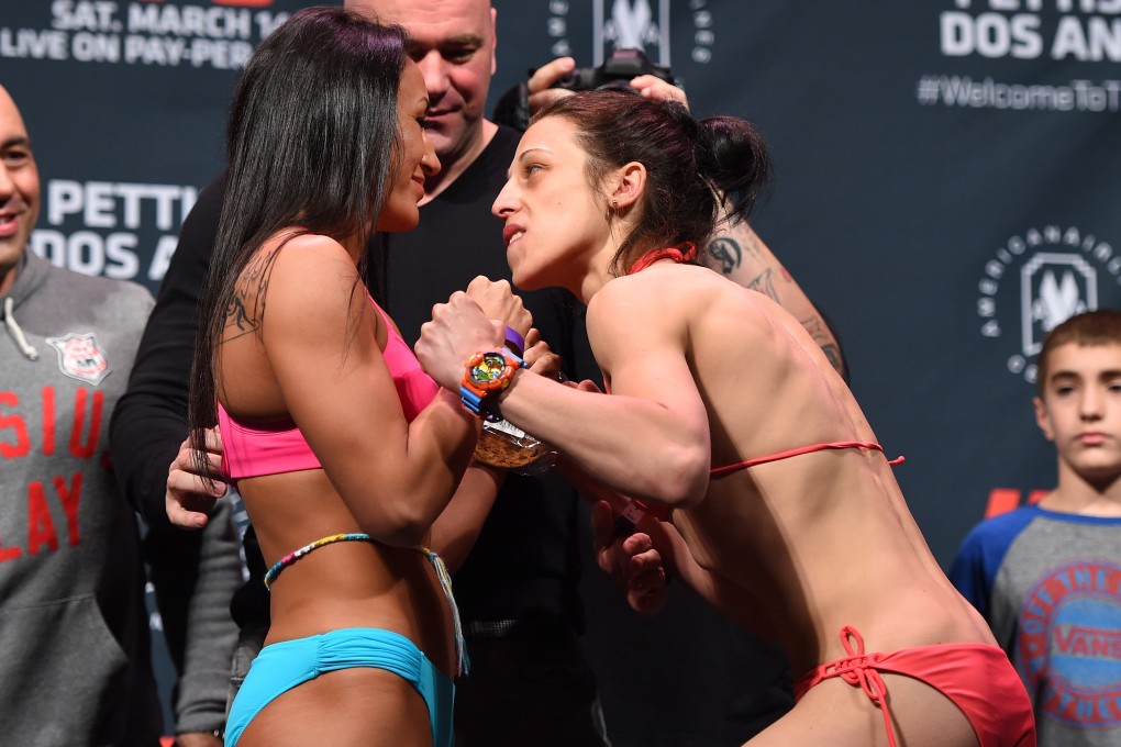 Carla Esparza (left) and Joanna Jedrzejczyk face off during the UFC 185 weigh-ins in Dallas in 2015. Photo: Getty Images