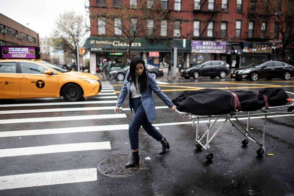 A worker transports a Covid-19 victim’s body to a funeral home in New York City. File photo: AFP