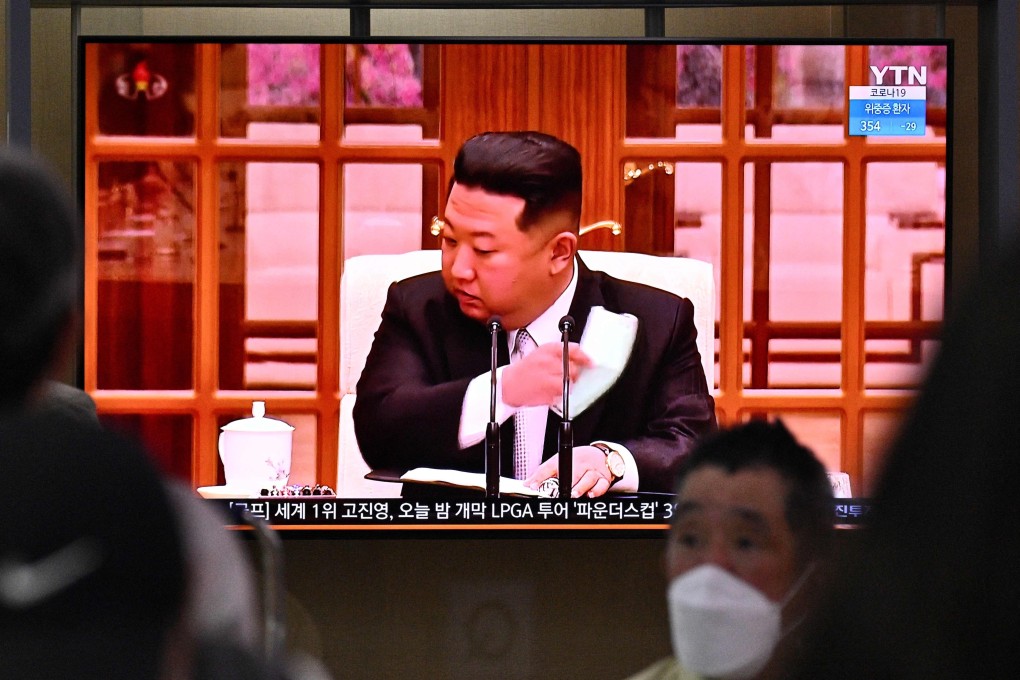 North Korean leader Kim Jong-un seen removing his mask in a news clip broadcast on South Korean television. Photo: AFP