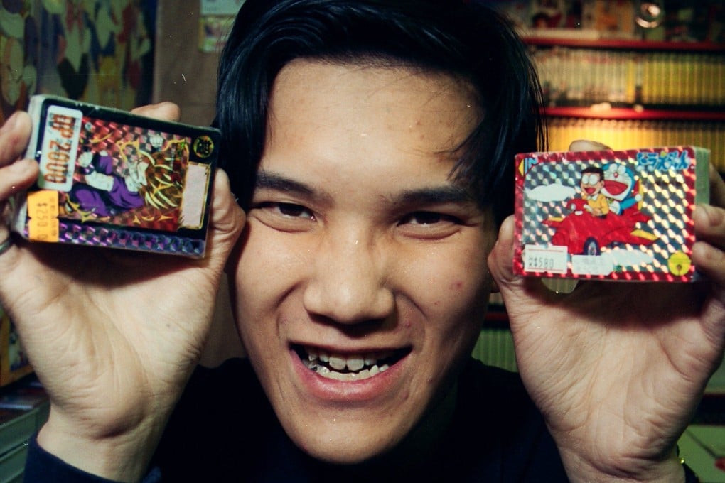 Cartoon card dealer Kwong Chi-hung displays cards based on Japanese comic strips in his shop in Kowloon City in March 1994. Cards made in limited editions in Japan became very valuable by the time they reached Hong Kong. Photo: SCMP