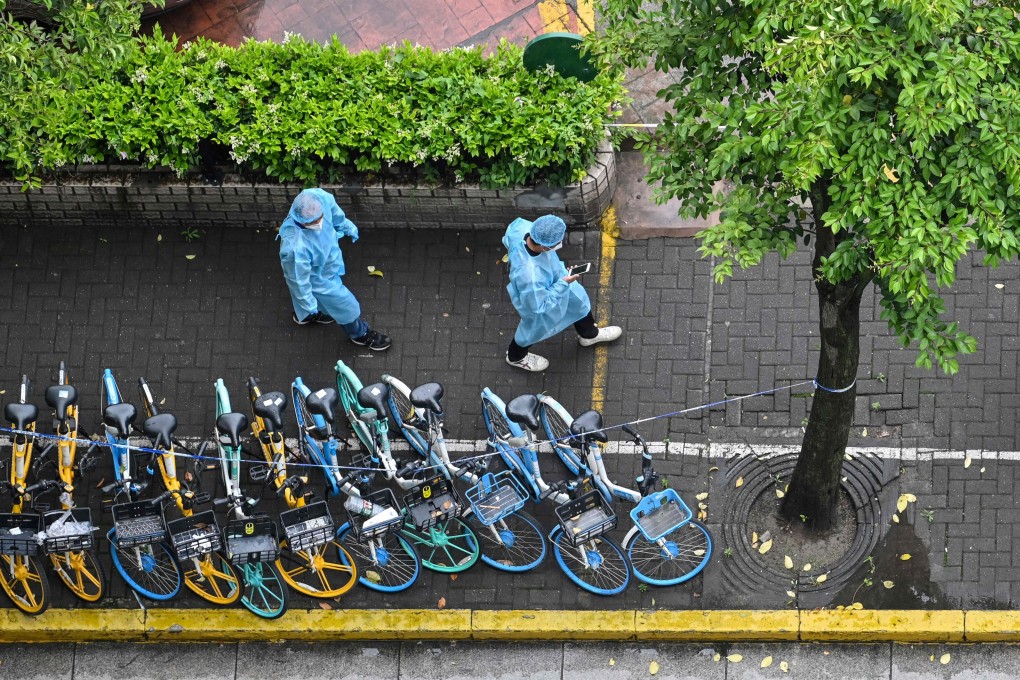 Officers in protective gear during a coronavirus lockdown in Shanghai’s Jingan district. Photo: AFP