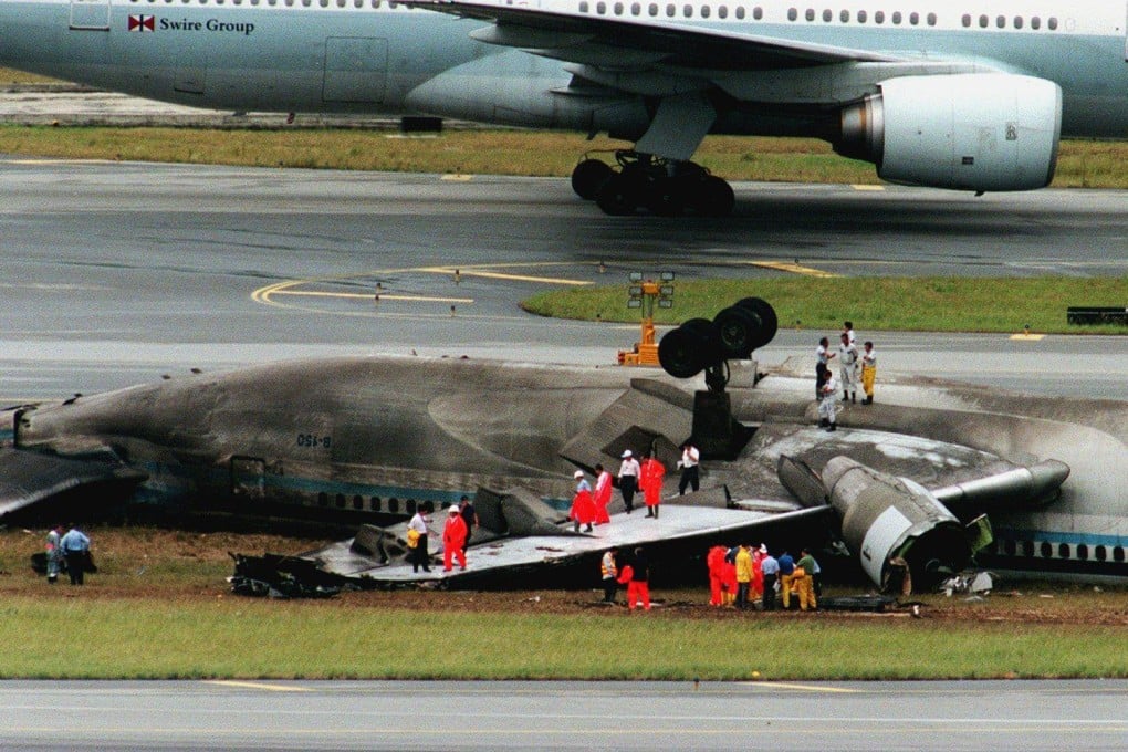 Investigators inspect the wreckage of the plane. Photo: Oliver Tsang