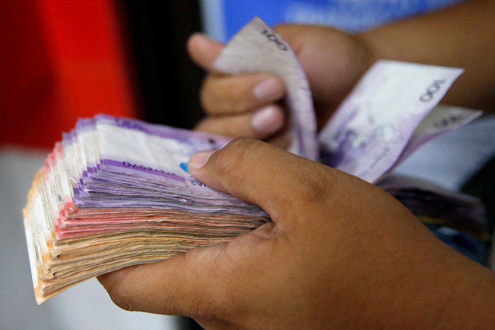 Filipinos should see a few more pesos in their wages soon. Photo: Reuters