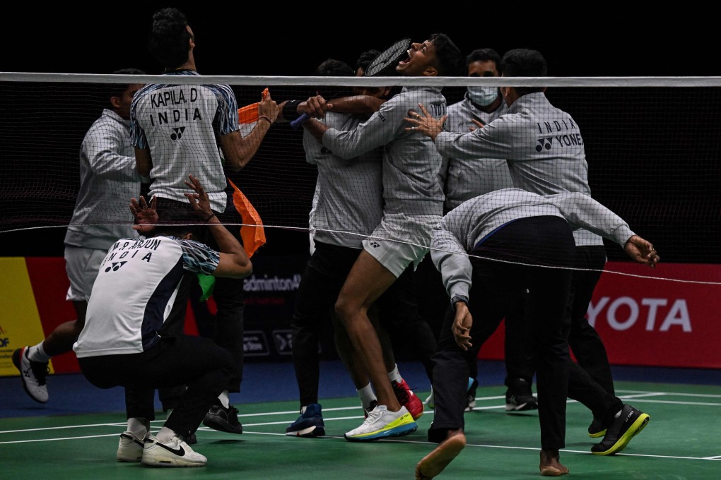 Members of Indias badminton team celebrate after H.S. Prannoy’s victory over Rasmus Gemke in the semi-finals of the Thomas Cup. Photo: AFP