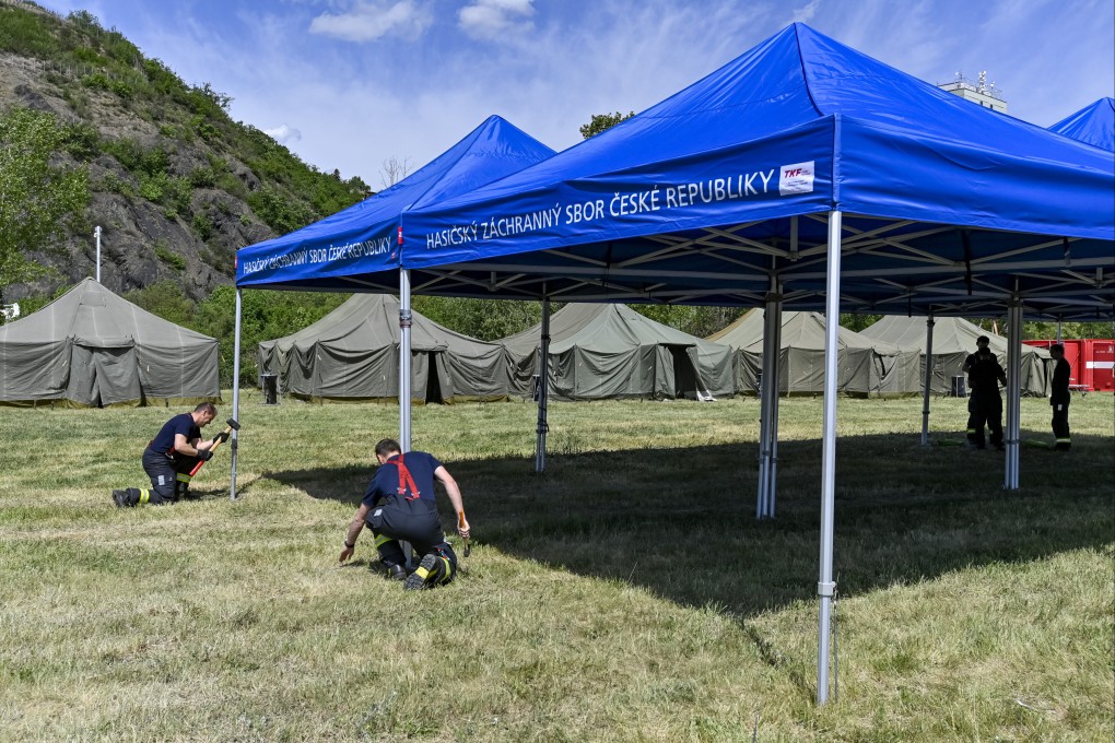 Workers put the final touches on a camp for Ukrainian refugees in Prague, Czech Republic. Photo: CTK / DPA