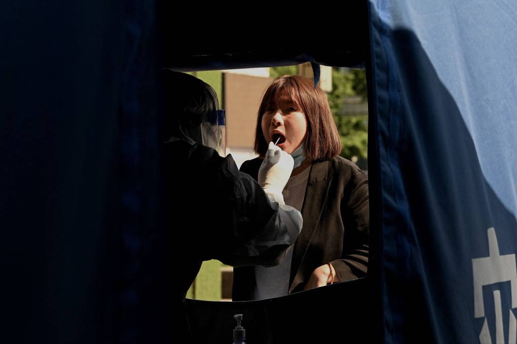Testing booths will be set up for routine weekly mass screening in cities with more than 10 million people. Photo: AFP