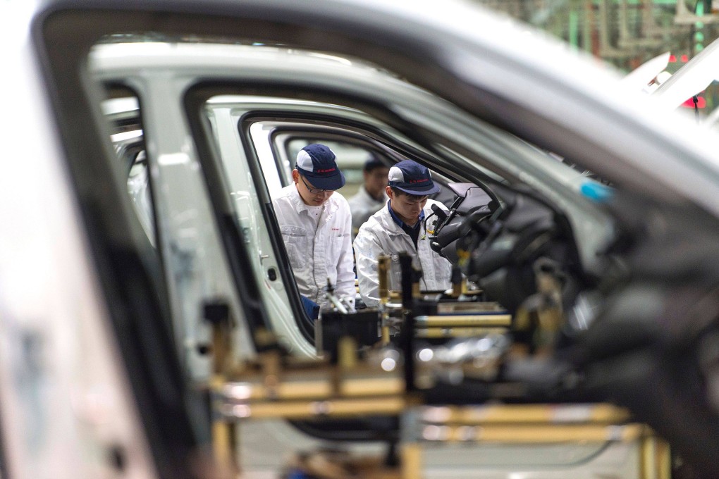 Employees work on the Honda Civic production line at a factory in Wuhan that the Japanese carmaker operates as a joint venture with China’s Dongfeng Motor Group. Japanese manufacturers are increasingly looking to move offshore operations back home, according to reports. Photo: AFP