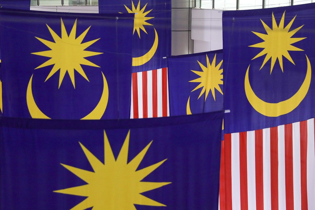 Malaysian national flags; the nation is seeking to increase its sovereign wealth fund. Photo: EPA-EFE
