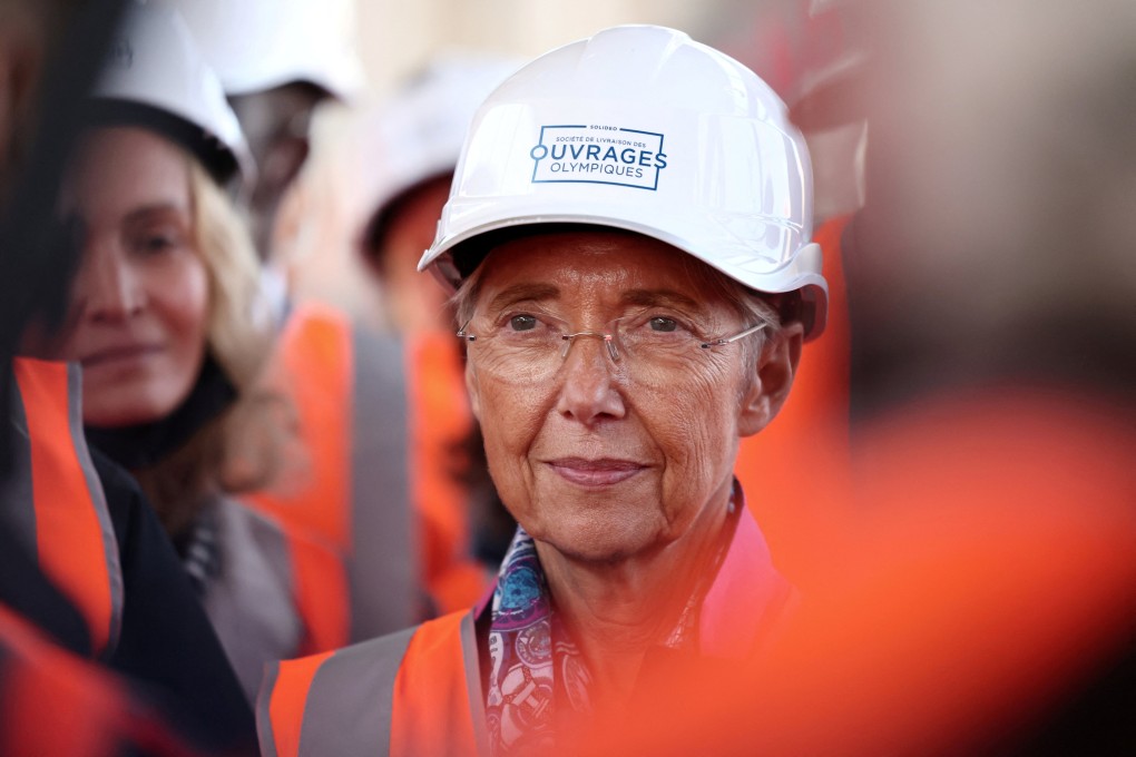 French Labour Minister Elisabeth Borne visits the building site of the Olympic Village in Saint-Ouen in October 2021. Photo: Reuters