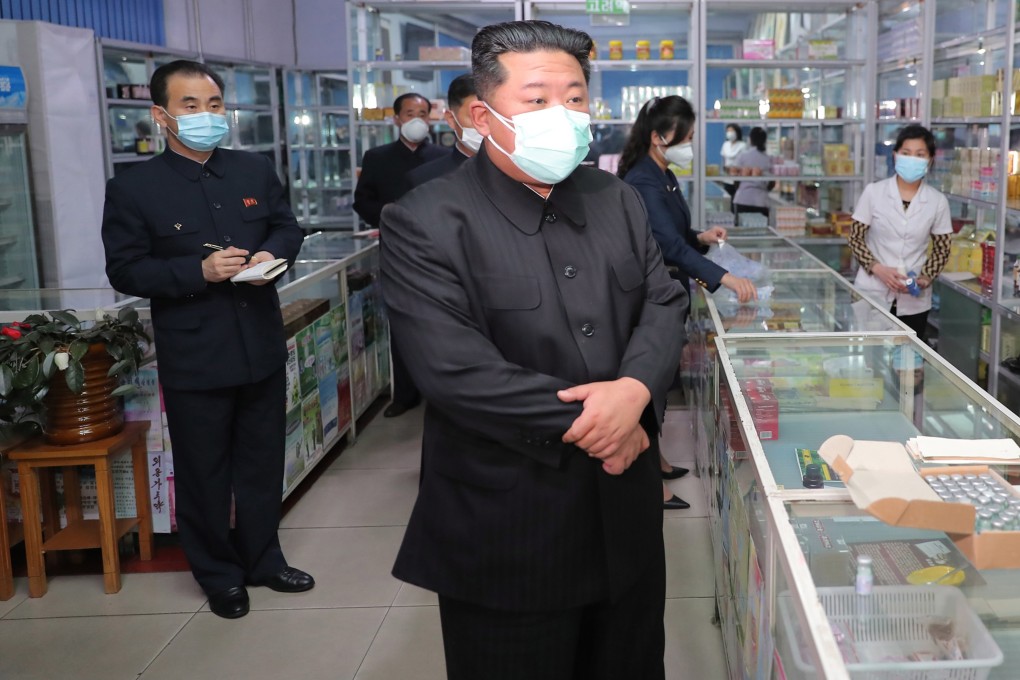 North Korean leader Kim Jong-un wears a face mask while inspecting a pharmacy in Pyongyang, North Korea on Sunday. Photo: EPA-EFE/KCNA