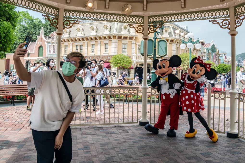 A visitor takes a selfie at Walt Disney Co.’s Disneyland Resort during its reopening in Hong Kong. File Photo: Bloomberg