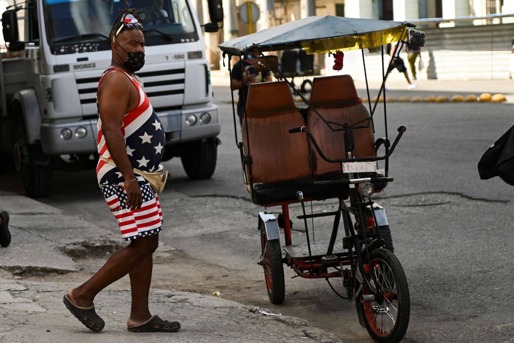 A man in Havana, wearing a T-shirt and a shorts with the US flag. Photo: AFP