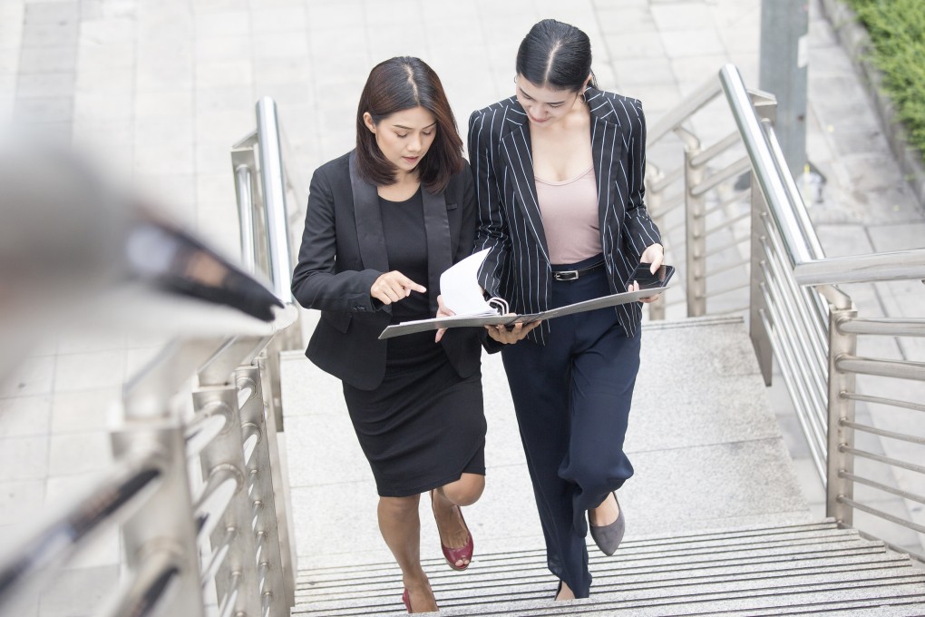 Business people talking for business plan while walking. Woman walking concept. 20-30 year old. Shutterstock ID: 684111424. Photo: Shutterstock