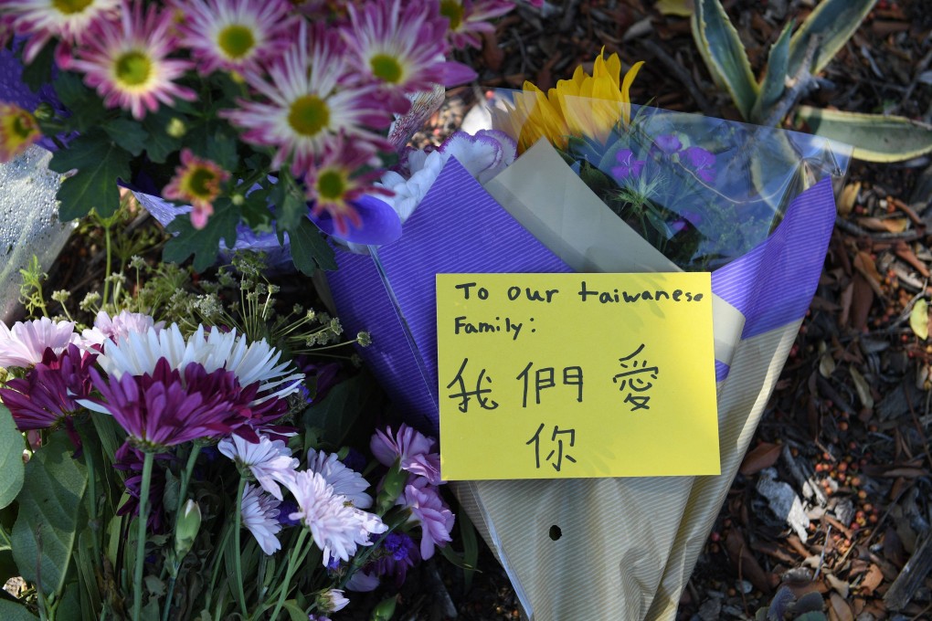 Flowers and notes are seen at a makeshift memorial outside the Geneva Presbyterian Church May 16, 2022. Photo: AFP