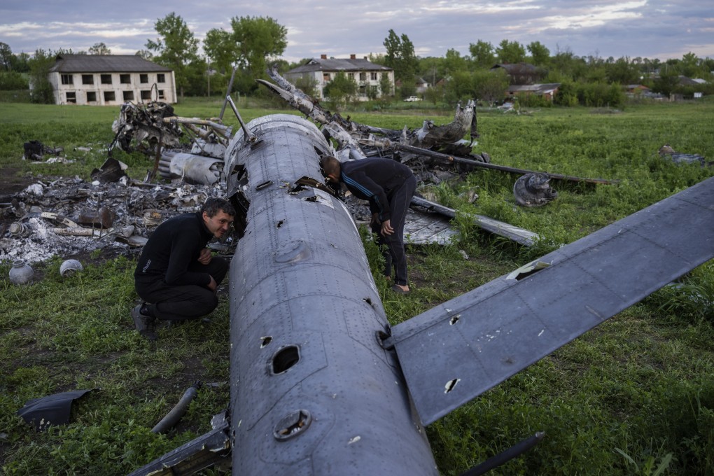 The remains of a destroyed Russian helicopter lie in a field in the village of Malaya Rohan in Ukraine’s Kharkiv region on Monday. Photo: AP