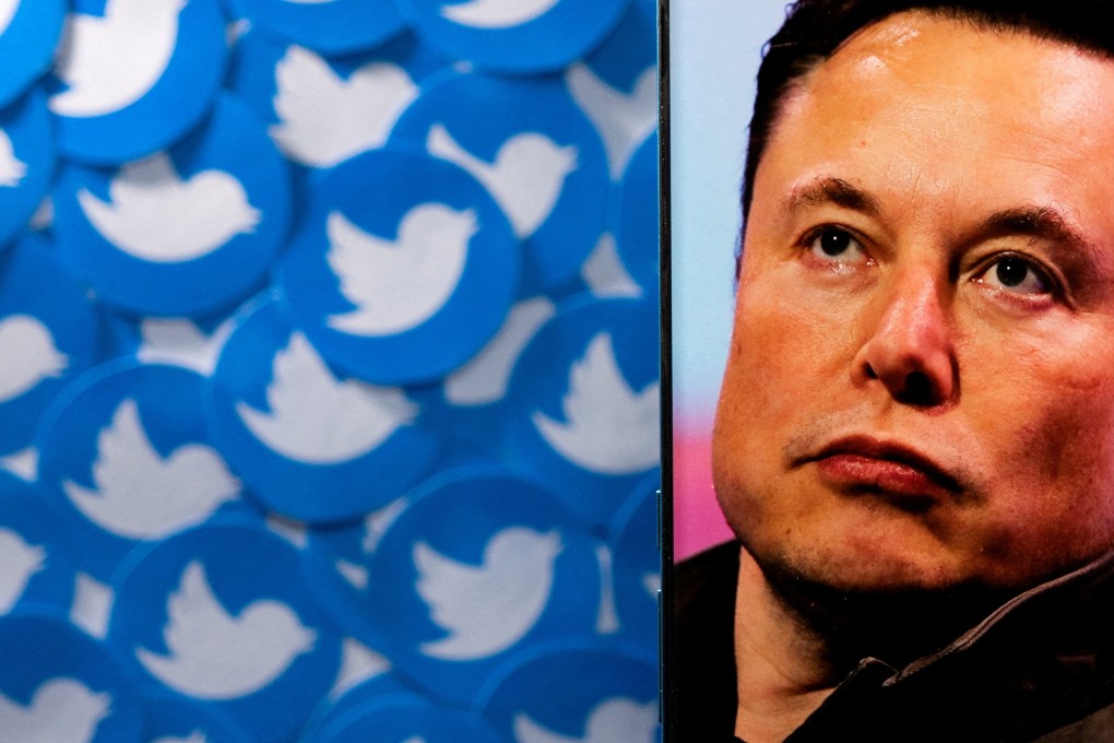 An image of Elon Musk is seen on a smartphone placed on printed Twitter logos in this picture illustration taken April 28. Photo: Reuters