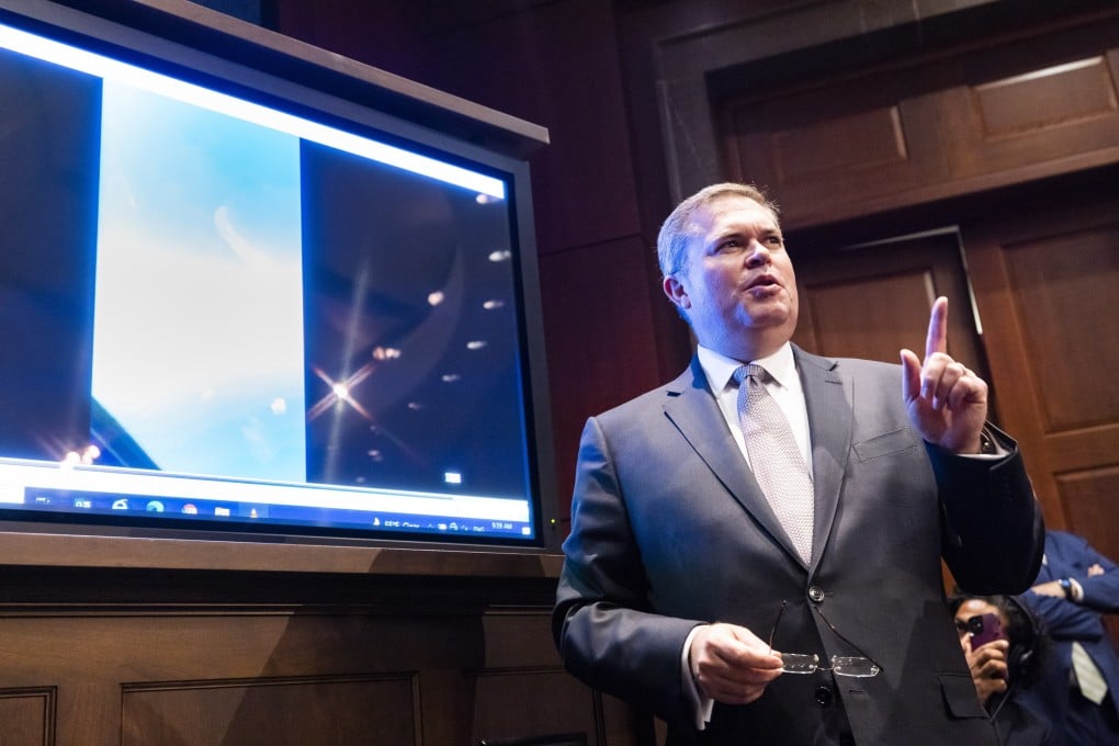 US Deputy Director of Naval Intelligence Scott Bray plays a video of an “unidentified aerial phenomena”, commonly referred to as UFOs, during a hearing before a subcommittee of the House Intelligence Committee on the phenomena in Washington on Tuesday. Photo: EPA-EFE