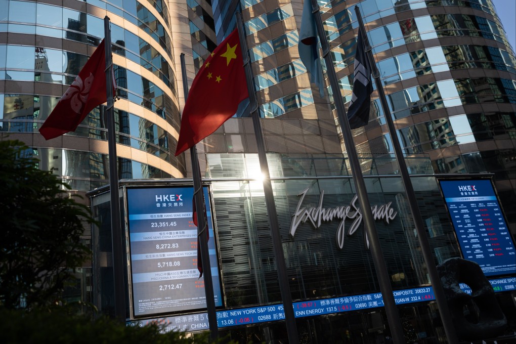 The Chinese flag and the Hong Kong SAR flag fly outside Exchange Square, the building housing the bourse in Hong Kong. Photo: EPA-EFE