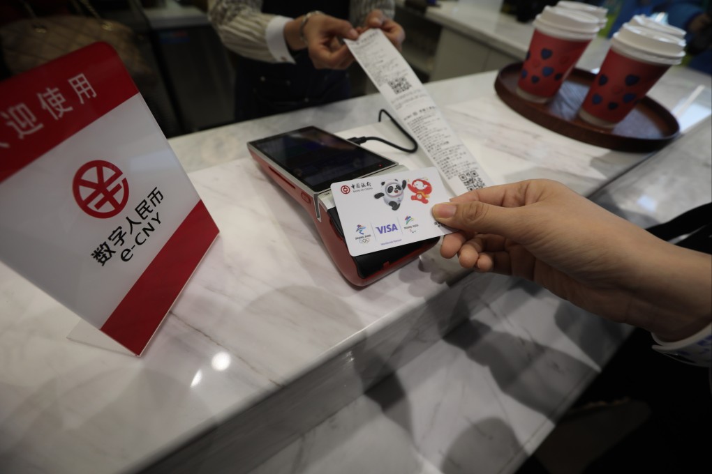 A demonstrator shows how to buy coffee with Chinese digital currency at the New Actuation Fintech Center in Beijing. Photo: Simon Song