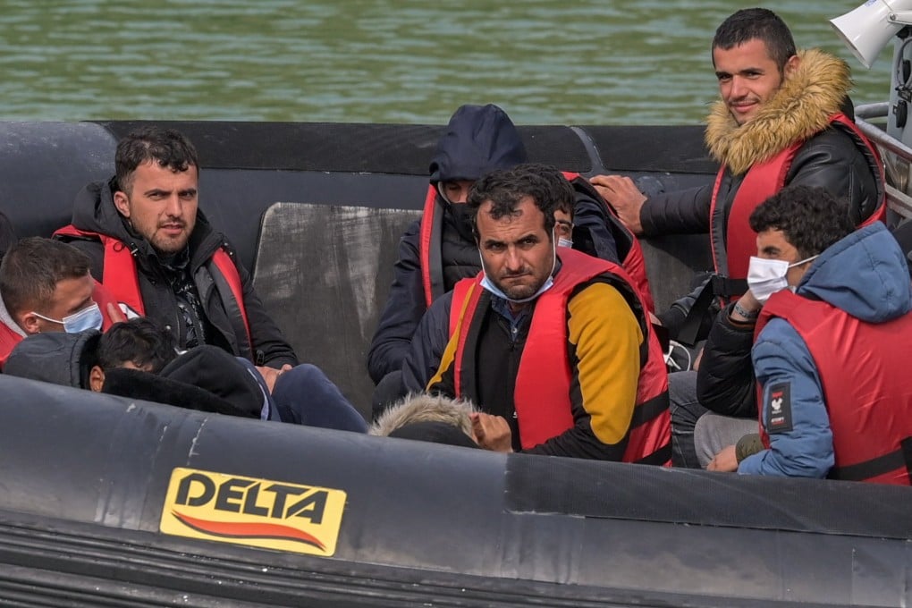 People arrive at Dover Docks after British Border Force Officials picked up a boat carrying migrants in the English Channel. Under a scheme designed to crack down on migrants landing on British shores after crossing the Channel in small boats, the UK intends to provide those deemed to have arrived unlawfully with a one-way ticket to Rwanda. Photo: EPA-EFE