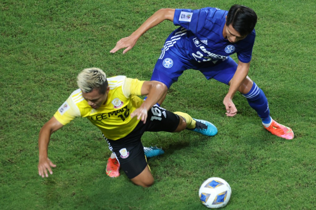 Lee Man’s Ngan Lok-fung (left) battles for the ball with Eastern Long Lions’ Wong Wai during their AFC Cup Group J match at Hong Kong Stadium on June 23, 2021. Photo: K. Y. Cheng