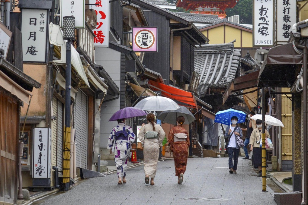 People walk near Kiyomizu temple in Kyoto, Japan. Japan will relax its Covid border restrictions from June 1, including by doubling its daily cap on the number of international arrivals allowed to 20,000. Photo: Kyodo via Getty Images