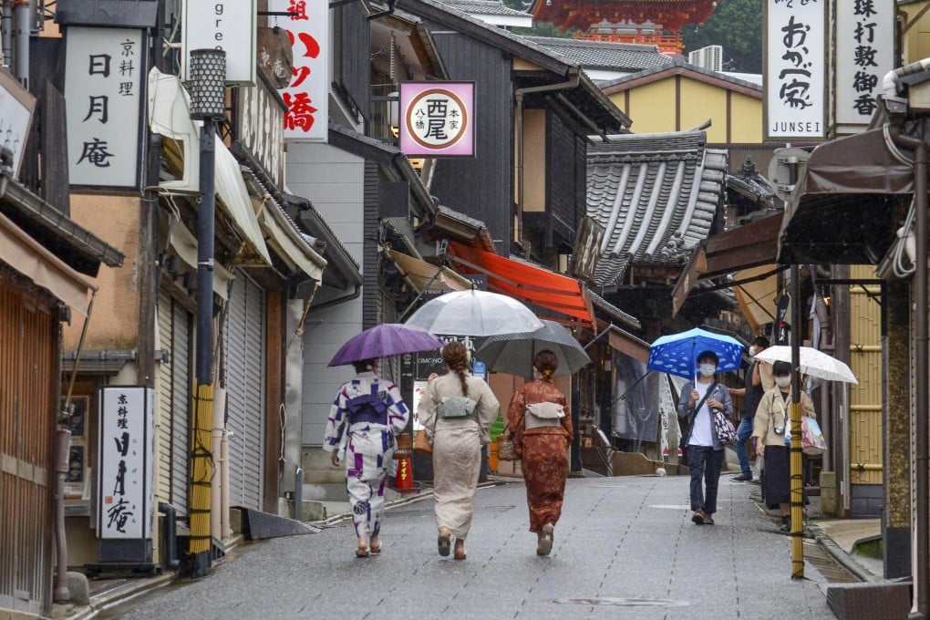 People walk near Kiyomizu temple in Kyoto, Japan. Japan will relax its Covid border restrictions from June 1, including by doubling its daily cap on the number of international arrivals allowed to 20,000. Photo: Kyodo via Getty Images