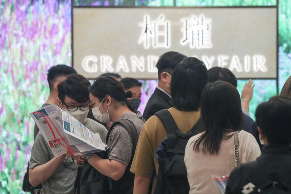 People line up in Tsim Sha Tsui to buy units at Grand Mayfair on Friday. Photo: Xiaomei Chen