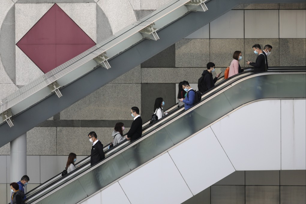 People enter and leave the government’s headquarters in Tamar, Admiralty, in December 2020. Photo: Nora Tam