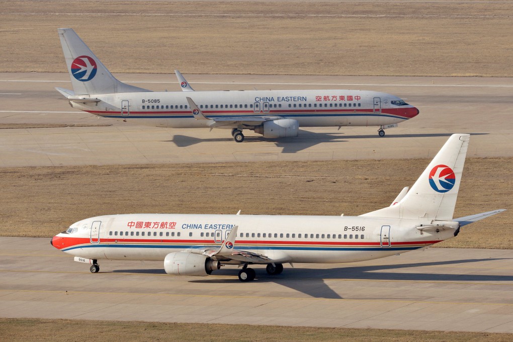 Two Boeing 737-800 planes bearing the livery of China Eastern Airlines at an airport in Taiyuan, Shanxi province on April 6, 2014. Photo: Reuters