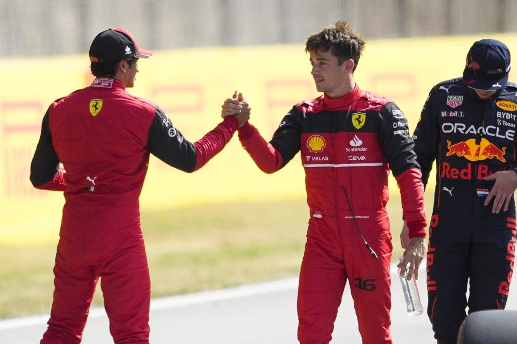 Ferrari’s Charles Leclerc (C) celebrates with teammate Carlos Sainz (left) after taking pole at the Spanish Grand Prix. Photo: EPA-EFE