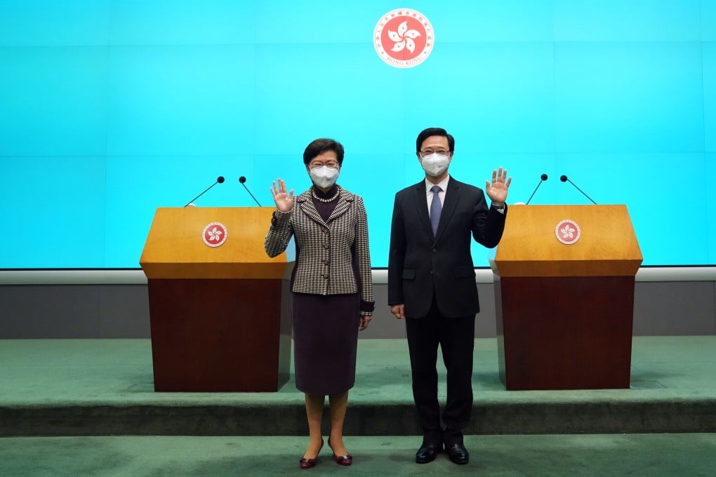Incumbent Chief Executive Carrie Lam Cheng Yuet-ngor, left, with Chief Executive-elect John Lee Ka-chiu this month. Photo: SCMP/ Sam Tsang