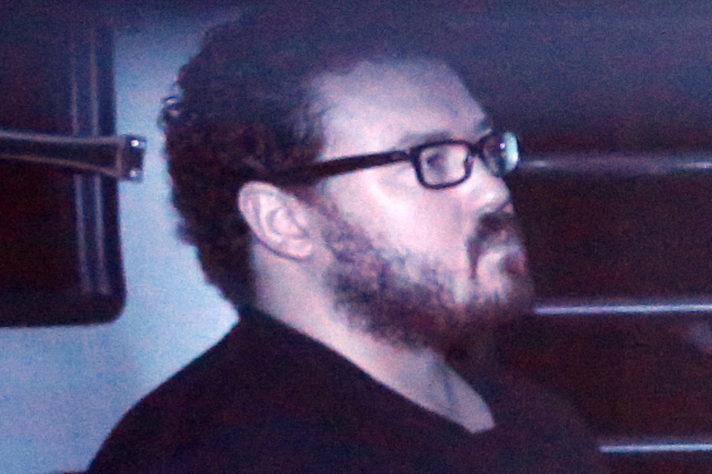 Rurik Jutting leaves the Eastern Magistrates Court in a prison van on November 24, 2014. Photo: Sam Tsang