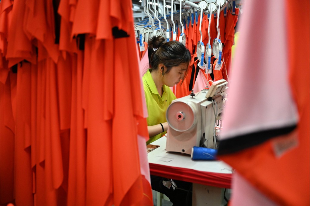 A woman works on the production line of the manufacturer of a Spanish sports brand in Jinjiang, in southeast China’s Fujian province, on May 13. Photo: Xinhua