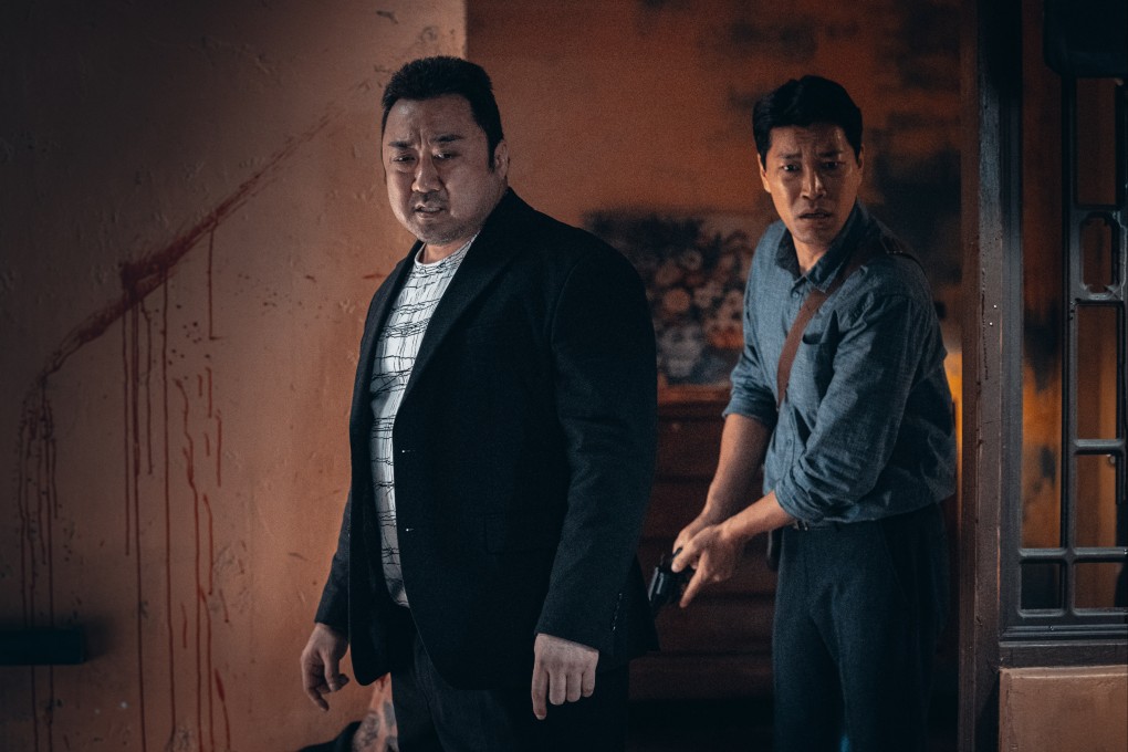 Ma Dong-seok (left) plays the police officer Don Lee, and Choi Gwi-hwa plays captain Jeon Il-mann a still from The Roundup.