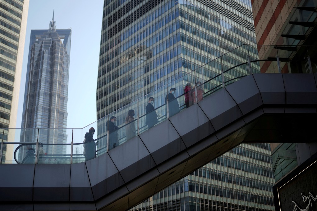 People enter an office in Lujiazui, mainland China’s largest financial district, in Shanghai, on February 24. Photo: Reuters