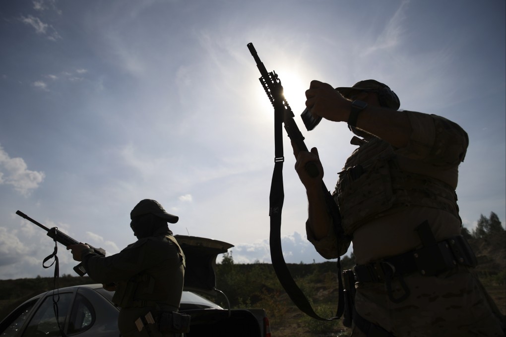 Volunteers from Belarus practice at a shooting range near Warsaw, Poland. Photo: AP