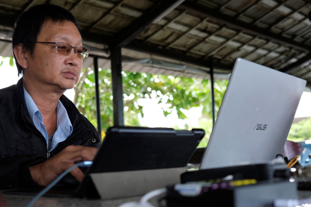 Radio enthusiast Robin Hsu, 50, monitors flight traffic in air space southwest of Taiwan, from a cafe in Pingtung, Taiwan on May 3, 2022. He says: “The Chinese Communist planes are like flies on your dining table. If you kill them on your plate then your meal is ruined. All you can do is to wave them away.” Photo: Reuters