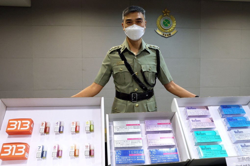 Assistant Superintendent Lie Yan-ning of customs’ air cargo search unit with the illegal smoking products seized in Hong Kong. Photo: Yik Yeung-man