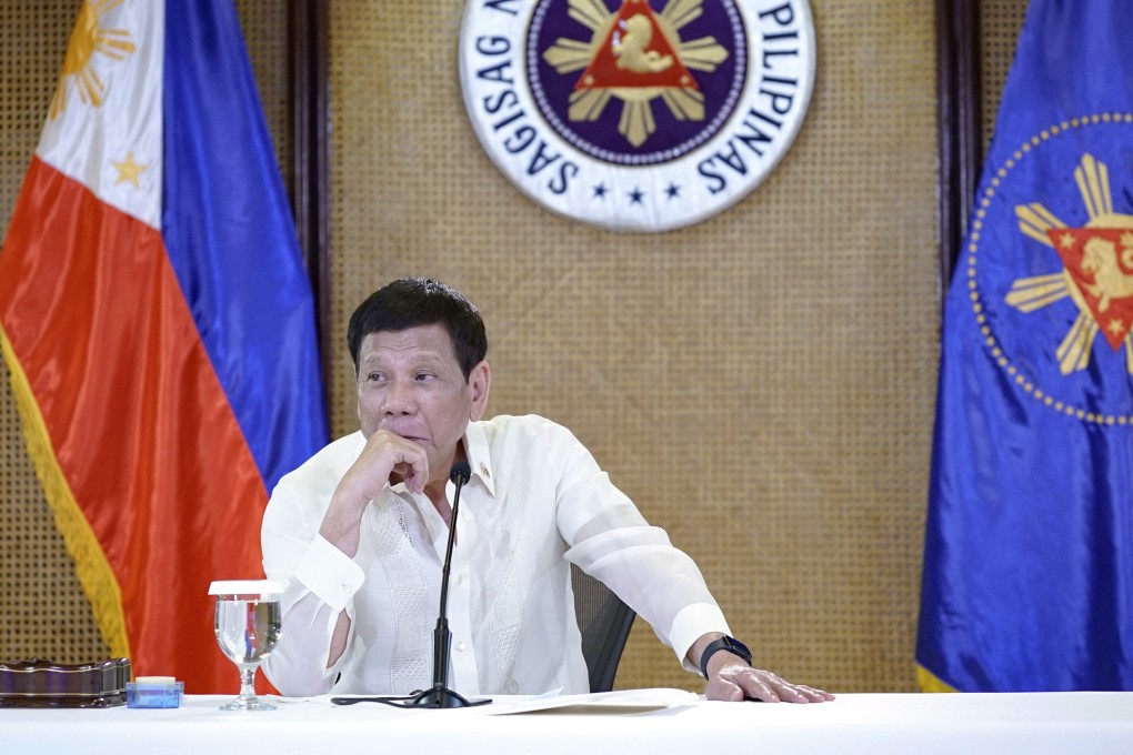 Philippine President Rodrigo Duterte listens during a meeting with government officials in Manila on Monday. Photo: King Rodriguez/ Malacanang Presidential Photographers Division via AP