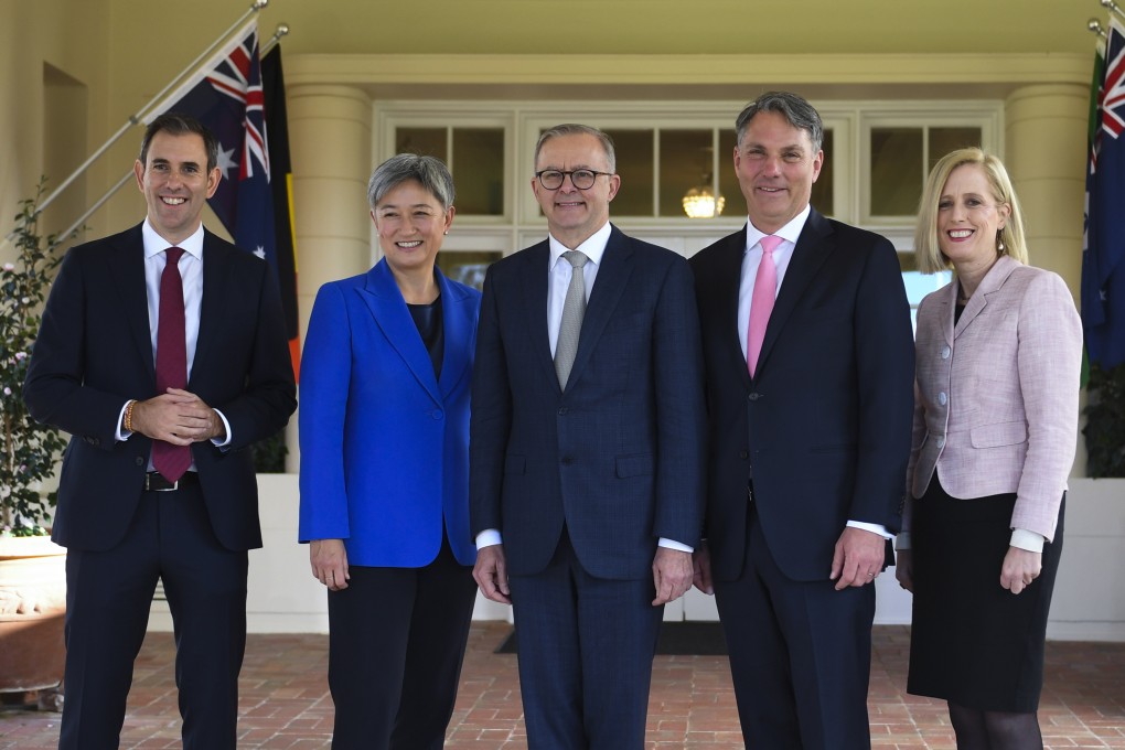 Australian Prime Minister Anthony Albanese (centre) poses for photographs with interim ministers (L-R) Jim Chalmers, Penny Wong, Richard Marles, and Katy Gallagher after a swearing-in ceremony at Government House in Canberra. Photo: AAP via dpa