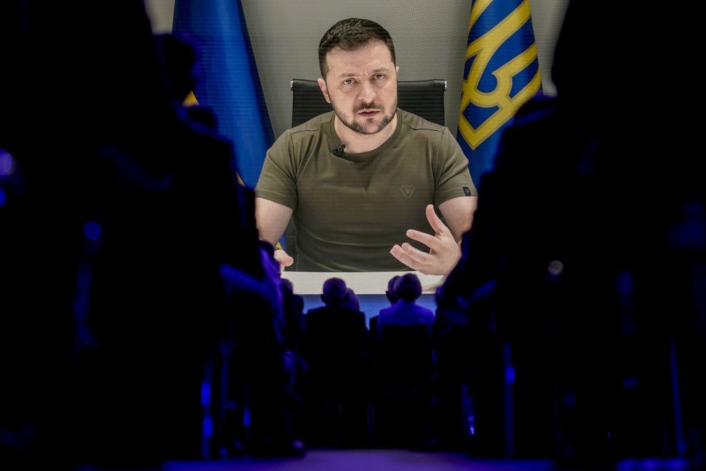 Ukrainian President Volodymyr Zelensky is displayed on a screen as he addresses the audience from Kyiv during the World Economic Forum in Davos, Switzerland, on May 23. Photo: AP