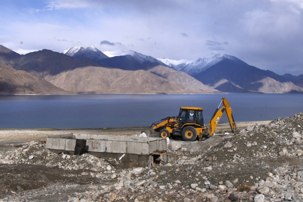 A bulldozer working on a road near Pangong Tso lake in the Himalayas. Photo: Kamran Yousuf