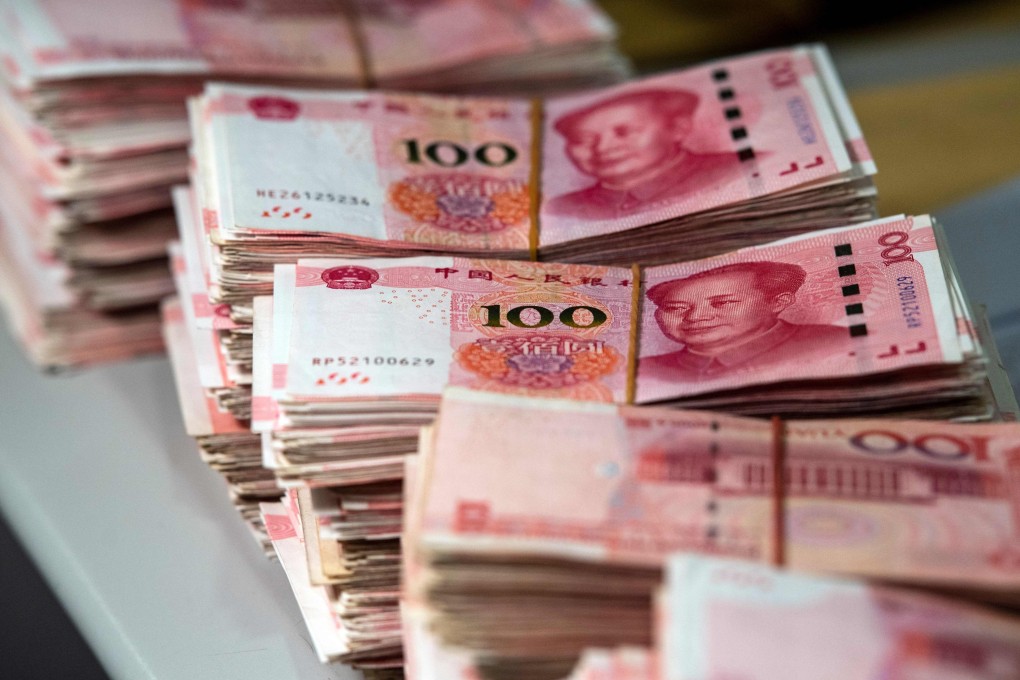 China’s slowing economy, reeling under strict coronavirus containment measures, and US interest rate increases have resulted in a  surge in outflows in recent months. Photo: AFP