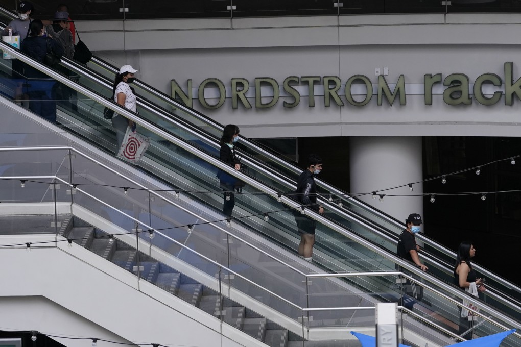 People shop at the Nordstrom Local DTLA in downtown Los Angeles on March 15. Some economists point to the decline in consumer confidence, to levels not seen in years, as evidence that higher prices are taking their toll. Photo: AP