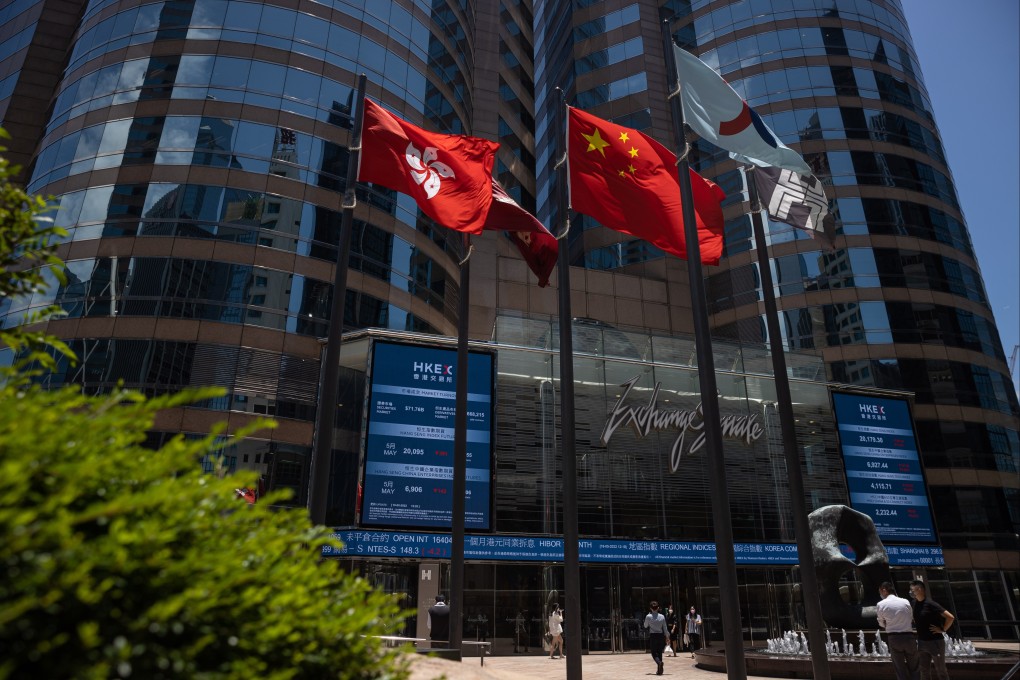 An electronic board shows the latest stock transactions outside Exchange Square in Central, Hong Kong on May 19. Photo: EPA-EFE